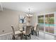 Elegant dining area with a view of the backyard pool at 11431 N 37Th Pl, Phoenix, AZ 85028