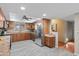 Spacious kitchen with stainless steel appliances and wood cabinets at 11431 N 37Th Pl, Phoenix, AZ 85028