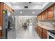 Open kitchen flowing into the dining area with backyard access at 11431 N 37Th Pl, Phoenix, AZ 85028