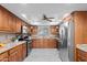 Well-equipped kitchen featuring stainless steel appliances and ample cabinet space at 11431 N 37Th Pl, Phoenix, AZ 85028