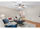 Inviting living room with bright natural light, comfortable furniture, and warm hardwood flooring at 11431 N 37Th Pl, Phoenix, AZ 85028