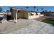 Back patio with tile flooring, lattice privacy, and a small patch of artificial grass at 120 N 54Th St, Mesa, AZ 85205