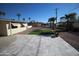 Backyard with stone tile patio and desert landscaping and artificial turf at 120 N 54Th St, Mesa, AZ 85205