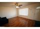 Bright living room featuring wood floors, a ceiling fan, and a window with natural light at 120 N 54Th St, Mesa, AZ 85205