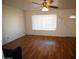 Bright living room featuring wood floors, a ceiling fan, and a window with natural light at 120 N 54Th St, Mesa, AZ 85205