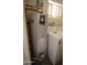 Bradford White water heater in the laundry room with white washer and dryer at 120 N 54Th St, Mesa, AZ 85205