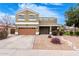 Inviting two-story home featuring low maintenance landscaping and a covered front porch at 12162 W Dreyfus Dr, El Mirage, AZ 85335