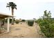 This backyard features desert landscaping and fencing at 12418 W Galaxy Dr, Sun City West, AZ 85375