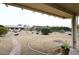 This backyard features a gravel yard and desert landscaping at 12418 W Galaxy Dr, Sun City West, AZ 85375