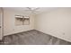 Cozy bedroom with a carpet, one window, and neutral paint at 12418 W Galaxy Dr, Sun City West, AZ 85375