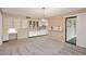 The dining room features built-in cabinets, a desk area, and a sliding glass door at 12418 W Galaxy Dr, Sun City West, AZ 85375