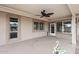 This covered patio features a ceiling fan at 12418 W Galaxy Dr, Sun City West, AZ 85375