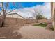 Spacious backyard with pavers, decorative rocks, a cozy seating area, and desert landscaping at 12530 W Jackson St, Avondale, AZ 85323