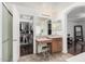 Elegant bathroom boasting double sinks with vanity and a large walk-in closet with custom shelving at 12530 W Jackson St, Avondale, AZ 85323