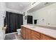 Well-lit bathroom with a spacious countertop, wooden cabinets, and a full-sized mirror at 12530 W Jackson St, Avondale, AZ 85323