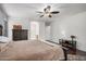 Spacious bedroom with hardwood floors and a view into the bathroom at 12530 W Jackson St, Avondale, AZ 85323