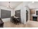 Bright dining room with tile flooring, dining table set, and easy access to the kitchen at 12530 W Jackson St, Avondale, AZ 85323