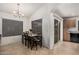 Dining room featuring a dark wooden table next to sliding glass door at 12530 W Jackson St, Avondale, AZ 85323