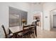 Dining room featuring a dark wooden table set next to the kitchen at 12530 W Jackson St, Avondale, AZ 85323