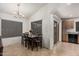 Dining room featuring a dark wooden dining set next to sliding glass door at 12530 W Jackson St, Avondale, AZ 85323