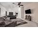 Bright living room features a sectional sofa and a view of the kitchen and dining area at 12530 W Jackson St, Avondale, AZ 85323