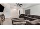 Comfortable living room featuring a sectional sofa and carpet at 12530 W Jackson St, Avondale, AZ 85323