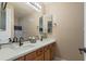 Modern bathroom featuring double sinks, quartz countertops, and updated fixtures with ample vanity space at 13432 N 154Th Ln, Surprise, AZ 85379