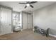 Neutral bedroom featuring a chair, bench and a large closet for ample storage at 13432 N 154Th Ln, Surprise, AZ 85379