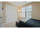 Neutral bedroom featuring a large closet and natural light from the large window with pleated blinds at 13432 N 154Th Ln, Surprise, AZ 85379