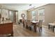 Neutral dining area with wood table, upholstered chairs, and natural light at 13432 N 154Th Ln, Surprise, AZ 85379