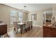 Dining room featuring contemporary light fixture, table and chairs and windows at 13432 N 154Th Ln, Surprise, AZ 85379