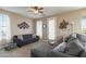 Relaxing living room featuring comfortable seating, soft lighting, and neutral tones at 13432 N 154Th Ln, Surprise, AZ 85379