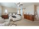 Relaxing main bedroom with a dresser, sliding barn door to the ensuite, and soft neutral tones at 13432 N 154Th Ln, Surprise, AZ 85379