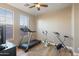 Spacious workout room featuring a treadmill, stationary bike, and bright windows at 13432 N 154Th Ln, Surprise, AZ 85379