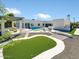 Aerial view of backyard featuring putting green, pool and entertaining areas at 13613 N 76Th St, Scottsdale, AZ 85260