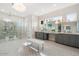 Luxurious primary bathroom featuring double vanity, rainfall shower, pendant lighting, and designer finishes at 13613 N 76Th St, Scottsdale, AZ 85260