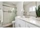 Bright bathroom featuring modern fixtures, marble countertop, and a glass-enclosed shower at 13613 N 76Th St, Scottsdale, AZ 85260