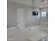 Elegant bathroom featuring a freestanding tub, glass shower, chandelier, and designer wall finishes at 13613 N 76Th St, Scottsdale, AZ 85260