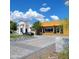 Contemporary home features a well-manicured front yard with a paver driveway and lush landscaping at 13613 N 76Th St, Scottsdale, AZ 85260