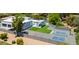 Aerial shot showcasing a sprawling backyard with pool, sport court, manicured landscaping, and modern architectural design at 13613 N 76Th St, Scottsdale, AZ 85260