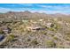 Scenic aerial view of a custom home in a desert community boasting mountain views and blue skies at 15241 E Pageland Cir, Fountain Hills, AZ 85268