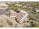 Elevated perspective showcasing an impressive custom home with a unique roof design in a desert setting at 15241 E Pageland Cir, Fountain Hills, AZ 85268