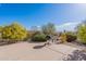 Backyard featuring a built-in grill, desert landscaping, and scenic views at 15241 E Pageland Cir, Fountain Hills, AZ 85268