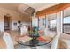 Stylish dining area with round glass table, comfortable chairs, and bright natural lighting at 15241 E Pageland Cir, Fountain Hills, AZ 85268