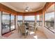 Bright dining area with scenic views, comfortable seating, and access to outdoor deck at 15241 E Pageland Cir, Fountain Hills, AZ 85268