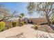 Beautiful home featuring desert landscaping, barrel tile roof and circular driveway leading to a three car garage at 15241 E Pageland Cir, Fountain Hills, AZ 85268