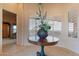 Grand foyer featuring tile floors, a decorative table centerpiece, and plantation shutters at 15241 E Pageland Cir, Fountain Hills, AZ 85268