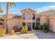 Lovely home entrance with desert landscaping, tile roof, and a circular driveway at 15241 E Pageland Cir, Fountain Hills, AZ 85268