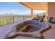 Relax in this hot tub with a serene mountain view on the covered patio space at 15241 E Pageland Cir, Fountain Hills, AZ 85268