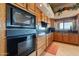 Modern kitchen featuring built in stainless steel appliances, wooden cabinetry and granite countertops at 15241 E Pageland Cir, Fountain Hills, AZ 85268